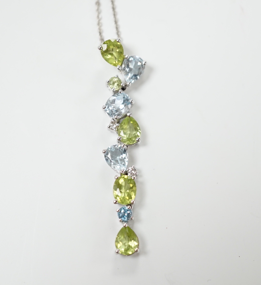 A modern 9ct white gold, peridot and blue topaz set pendant, 37mm, on a 375 chain, 40cm, gross weight 3.4 grams.